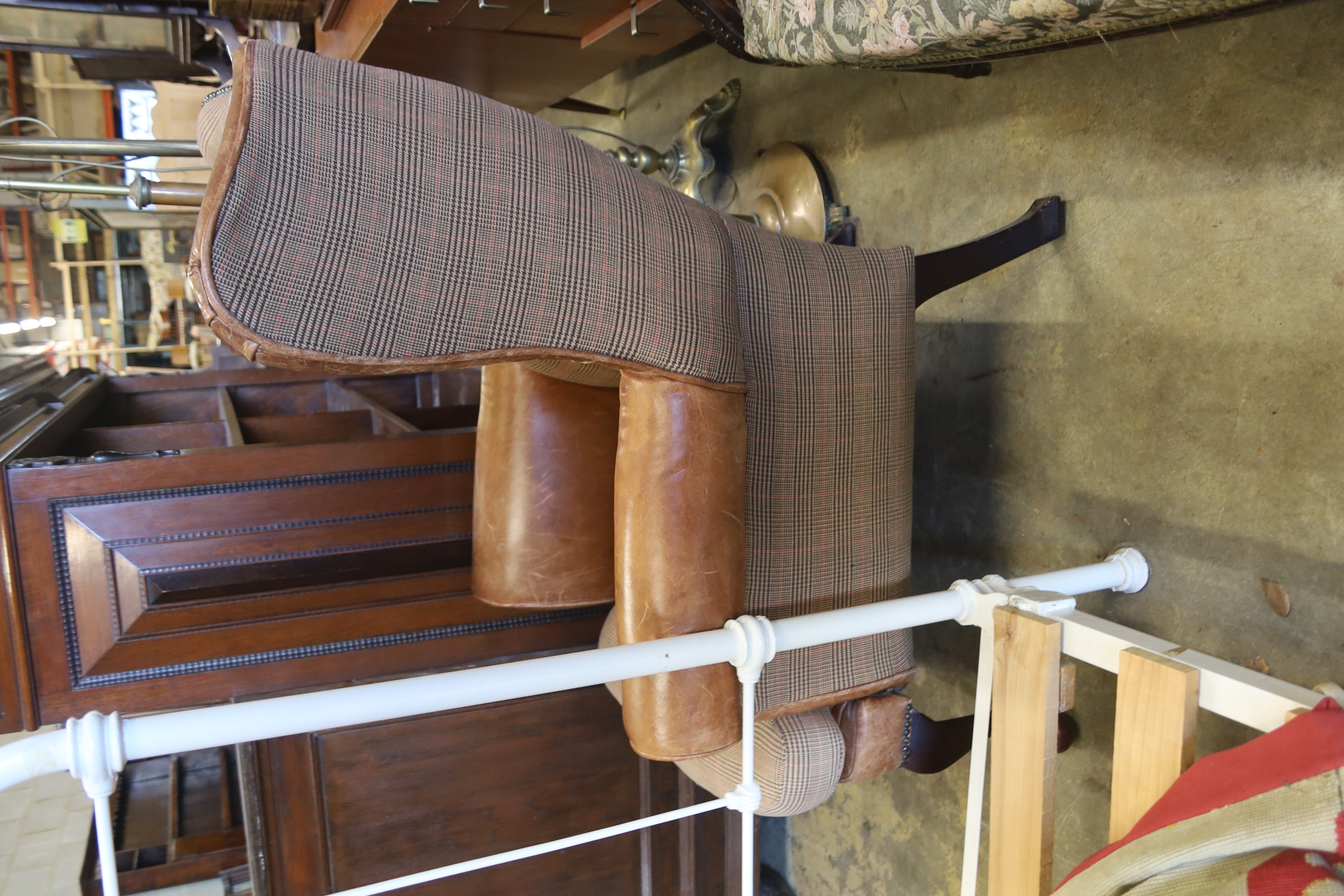 A Victorian style tweed and tan leather wing armchair, width 80cm, depth 84cm, height 98cm